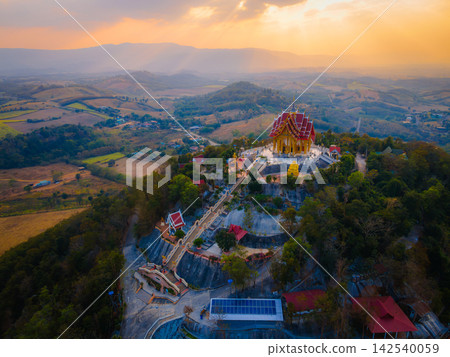 Landscape of Wat Pa Phu Hai Long temple on the mountain at sunset time at Pak Chong, Nakhon Ratchasima, Thailand. Landscape of Wat Pa Phu Hai Long temple on the mountain at sunset time at Pak Chong, Nakhon Ratchasima, Thailand. 142540059