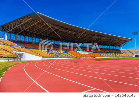 A beautiful stadium with an indoor football field and running track, and a roof to provide shade for spectators. A beautiful stadium with an indoor football field and running track, and a roof to provide shade for spectators. 142540143