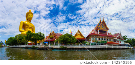 Panorama landscape of The large golden Buddha at Wat Pak Nam Phasi Charoen is the largest seated Buddha statue in Bangkok, Thailand It is a popular tourist destination and pilgrimage site and landmark Panorama landscape of The large golden Buddha at Wat Pak Nam Phasi Charoen is the largest seated Buddha statue in Bangkok, Thailand It is a popular tourist destination and pilgrimage site and landmark 142540196
