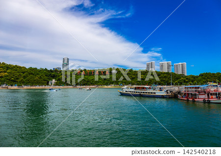 The Pattaya city sign at Khao Phra Tamnak, as seen from Laem Bali Hai Pier, is an iconic landmark that tourists from around the world must check in at. Chonburi, Thailand. The Pattaya city sign at Khao Phra Tamnak, as seen from Laem Bali Hai Pier, is an iconic landmark that tourists from around the world must check in at. Chonburi, Thailand. 142540218