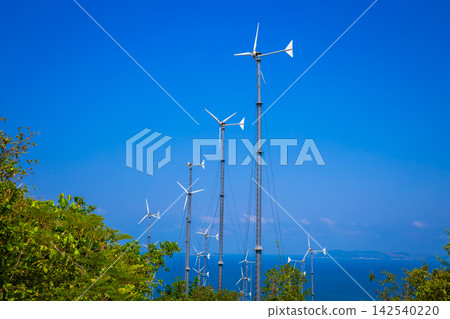 Wind turbines generating electricity on mountain with blue sky at Koh Larn, Pattaya, Chonburi, Thailand Wind turbines generating electricity on mountain with blue sky at Koh Larn, Pattaya, Chonburi, Thailand 142540220