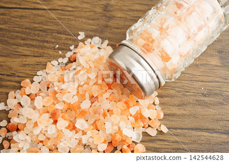 Sodium chloride Himalayan pink salt with salt shaker. Sodium chloride Himalayan pink salt with salt shaker. 142544628