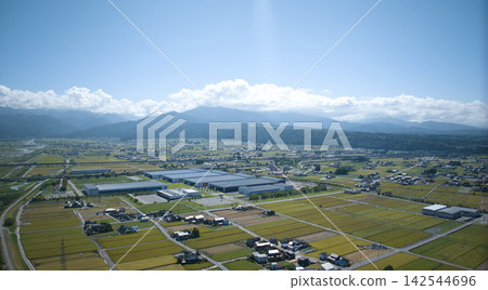 A scene from the Kurobe River alluvial fan in Toyama Prefecture, Japan, as the rice harvest season approaches. A scene from the Kurobe River alluvial fan in Toyama Prefecture, Japan, as the rice harvest season approaches. 142544696