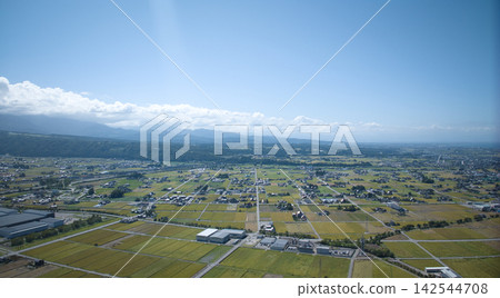 A scene from the Kurobe River alluvial fan in Toyama Prefecture, Japan, as the rice harvest season approaches. A scene from the Kurobe River alluvial fan in Toyama Prefecture, Japan, as the rice harvest season approaches. 142544708