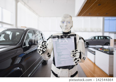 A futuristic robot stands in a car dealership holding a vehicle purchase agreement and a pen ready to finalize a sale A futuristic robot stands in a car dealership holding a vehicle purchase agreement and a pen ready to finalize a sale 142544864