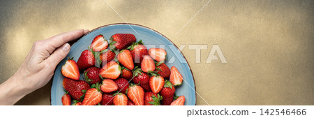 Fresh strawberries plate hand healthy banner Fresh strawberries plate hand healthy banner 142546466