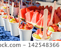Individual fresh fruit cups prepared for an outdoor picnic 142548366