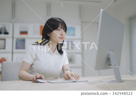 A young female designer working on a computer 142548522