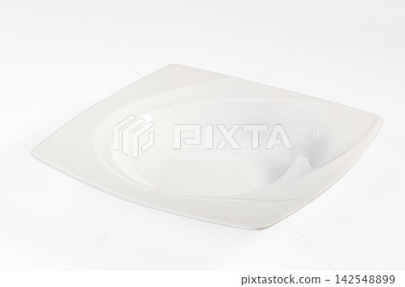 White square ceramic plate with subtle pattern on white background White square ceramic plate with subtle pattern on white background 142548899