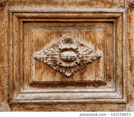Decorative wood panel showing ornate floral carving 142550653