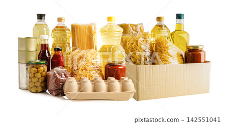 Foodstuffs in donation box isolated on white background. Foodstuffs in donation box isolated on white background. 142551041