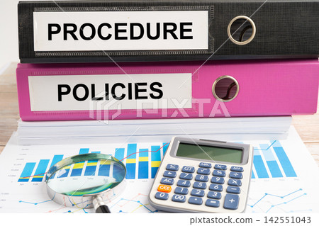 Pro, binder with graph and calculator at office. 142551043