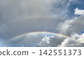 A double rainbow in the sky 142551373