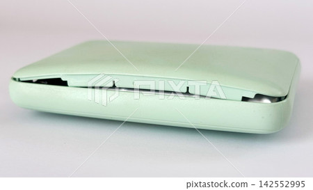 A mobile battery that has expanded and opened up - white background A mobile battery that has expanded and opened up - white background 142552995