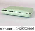A mobile battery that has expanded and opened up - white background 142552996