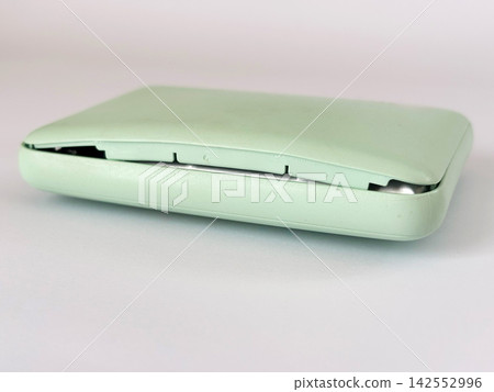 A mobile battery that has expanded and opened up - white background A mobile battery that has expanded and opened up - white background 142552996