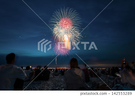 Fireworks soar high above the Osaka coastline Fireworks soar high above the Osaka coastline 142553289
