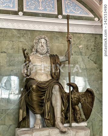 The famous colossal marble statue of the supreme Roman god Jupiter (Zeus) holding a scepter and Victory, sitting next to an eagle 142553490
