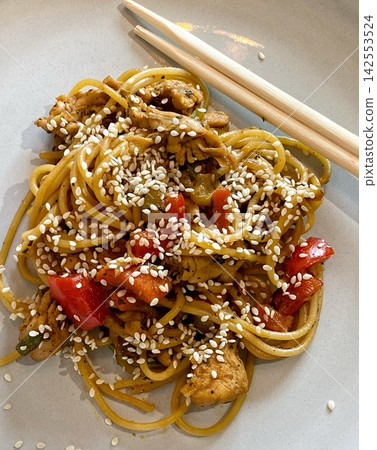 Chicken Stir Fry Noodles with Vegetables and Sesame Seeds Chicken Stir Fry Noodles with Vegetables and Sesame Seeds 142553524