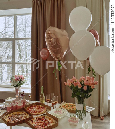 Cozy Birthday Party Table with Pizza Flowers Balloons and Cake Cozy Birthday Party Table with Pizza Flowers Balloons and Cake 142553673