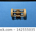 A wooden puzzle to take a bird out of a cage. 142555035