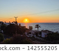 Golden hour ocean sunset view from a beach resort villa 142555205