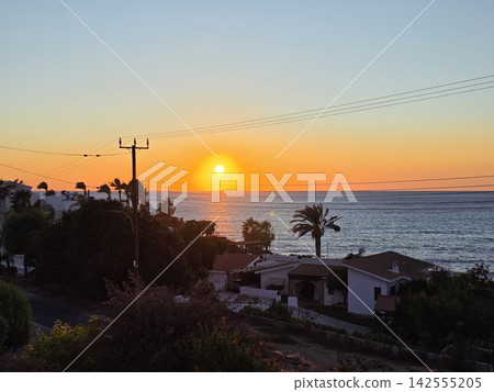 Golden hour ocean sunset view from a beach resort villa Golden hour ocean sunset view from a beach resort villa 142555205