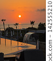 Golden hour ocean sunset view from a beach resort villa 142555210