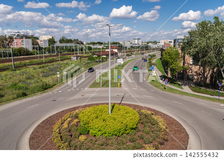 Elevated Warsaw Roundabout with Rail Tracks and City Traffic Elevated Warsaw Roundabout with Rail Tracks and City Traffic 142555432