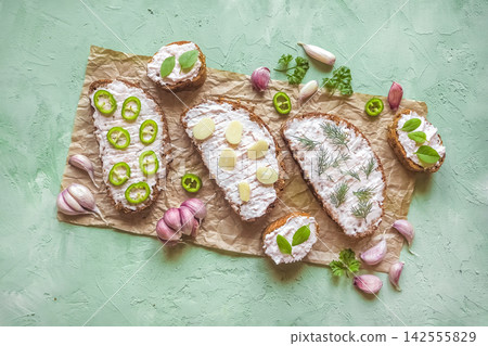 Traditional lard spread smalec sandwiches on rustic bread with garlic and jalapenos Traditional lard spread smalec sandwiches on rustic bread with garlic and jalapenos 142555829