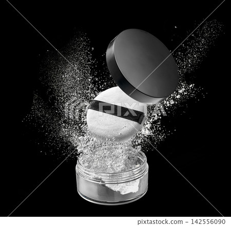 Loose powder compact with open lid and makeup puff floating above sparkling white particles on black studio background Loose powder compact with open lid and makeup puff floating above sparkling white particles on black studio background 142556090