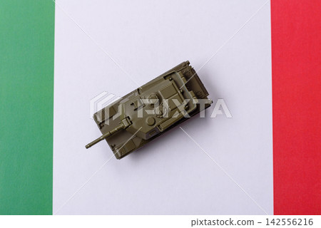 A tank on the Italian flag as a conceptual backdrop representing Europe's defense A tank on the Italian flag as a conceptual backdrop representing Europe's defense 142556216