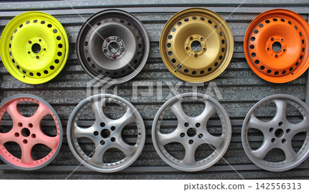 Multicolored samples of possible wheel rim paint for different cars Multicolored samples of possible wheel rim paint for different cars 142556313
