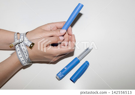 Ozempic and Weight Loss Treatment Concept Ozempic and Weight Loss Treatment Concept 142556513