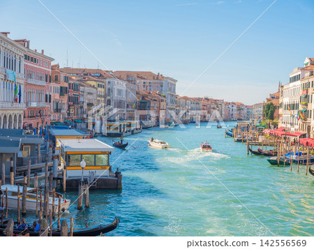 Landscape with Rialto Bridge and gondola Grand Canal in Venice, Italy, Europe. Landscape with Rialto Bridge and gondola Grand Canal in Venice, Italy, Europe. 142556569