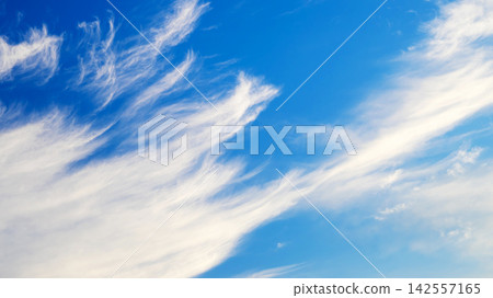sweeping cirrus clouds against a bright blue sky sweeping cirrus clouds against a bright blue sky 142557165