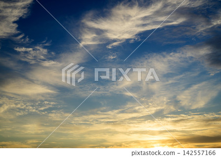 golden sunrise with white clouds and sunlight golden sunrise with white clouds and sunlight 142557166