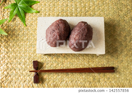 Overhead view of two ohagi (rice cakes). Overhead view of two ohagi (rice cakes). 142557856