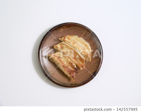3 pan-fried dumplings 3 pan-fried dumplings 142557995