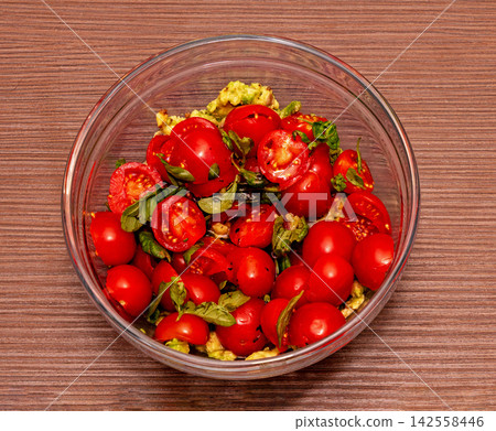 Tomato salad in glass bowl Tomato salad in glass bowl 142558446