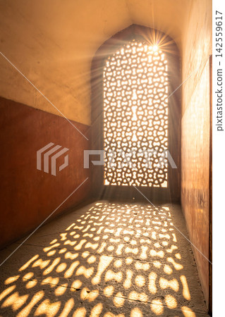 Light streaming in through the lattice window Light streaming in through the lattice window 142559617