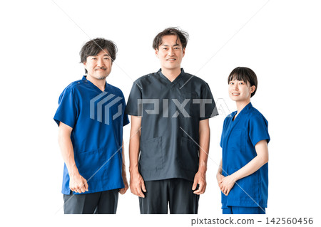 Three medical staff members smiling and standing side-by-side against a white background. A cutout image of people that can be used for team-based medical care or hospital recruitment. Three medical staff members smiling and standing side-by-side against a white background. A cutout image of people that can be used for team-based medical care or hospital recruitment. 142560456