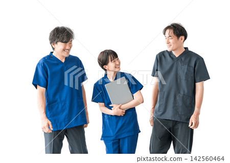 A doctor and three medical staff members communicating with smiles. A cutout image of people representing teamwork and collaboration in healthcare. A doctor and three medical staff members communicating with smiles. A cutout image of people representing teamwork and collaboration in healthcare. 142560464
