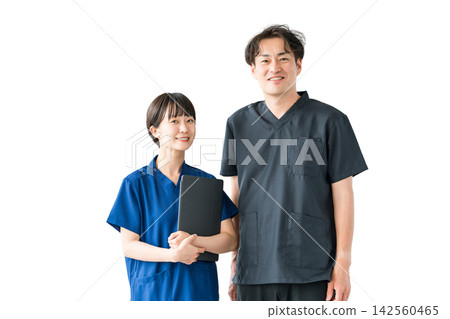 A smiling male and female doctor and two medical staff members standing side by side. A cutout image of people that can be used for hospital team medicine or recruitment. A smiling male and female doctor and two medical staff members standing side by side. A cutout image of people that can be used for hospital team medicine or recruitment. 142560465