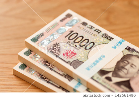 A stack of 3 million yen bills A stack of 3 million yen bills 142561490