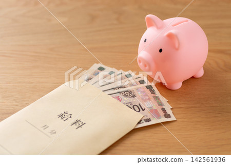 Pink pig piggy bank and salary Pink pig piggy bank and salary 142561936