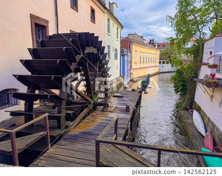 The Velkoprevorsky mlyn with its large wooden waterwheel on the Certovka Canal The Velkoprevorsky mlyn with its large wooden waterwheel on the Certovka Canal 142562125
