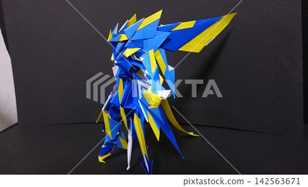"Night Dragon," an original origami creation depicting a blue and yellow dragon knight. "Night Dragon," an original origami creation depicting a blue and yellow dragon knight. 142563671