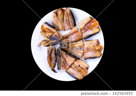 Top view of Crispy Deep-Fried Sun-Dried Catfish Served as Traditional Thai Dish Top view of Crispy Deep-Fried Sun-Dried Catfish Served as Traditional Thai Dish 142563955
