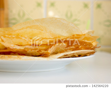 Pancakes lying on a plate. Pancakes lying on a plate. 142564220